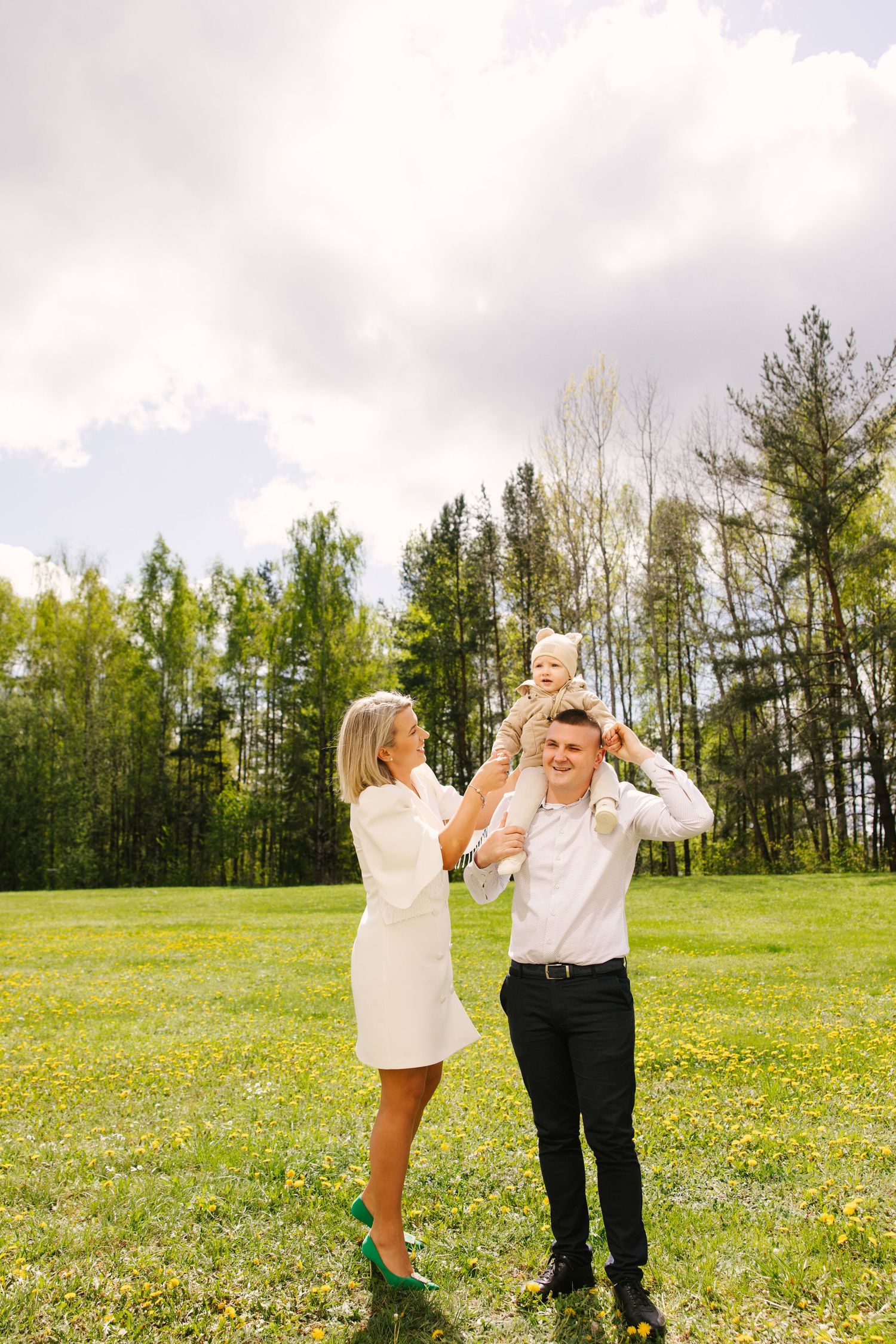 A series of candid moments captured in a sunny meadow with trees in the background.