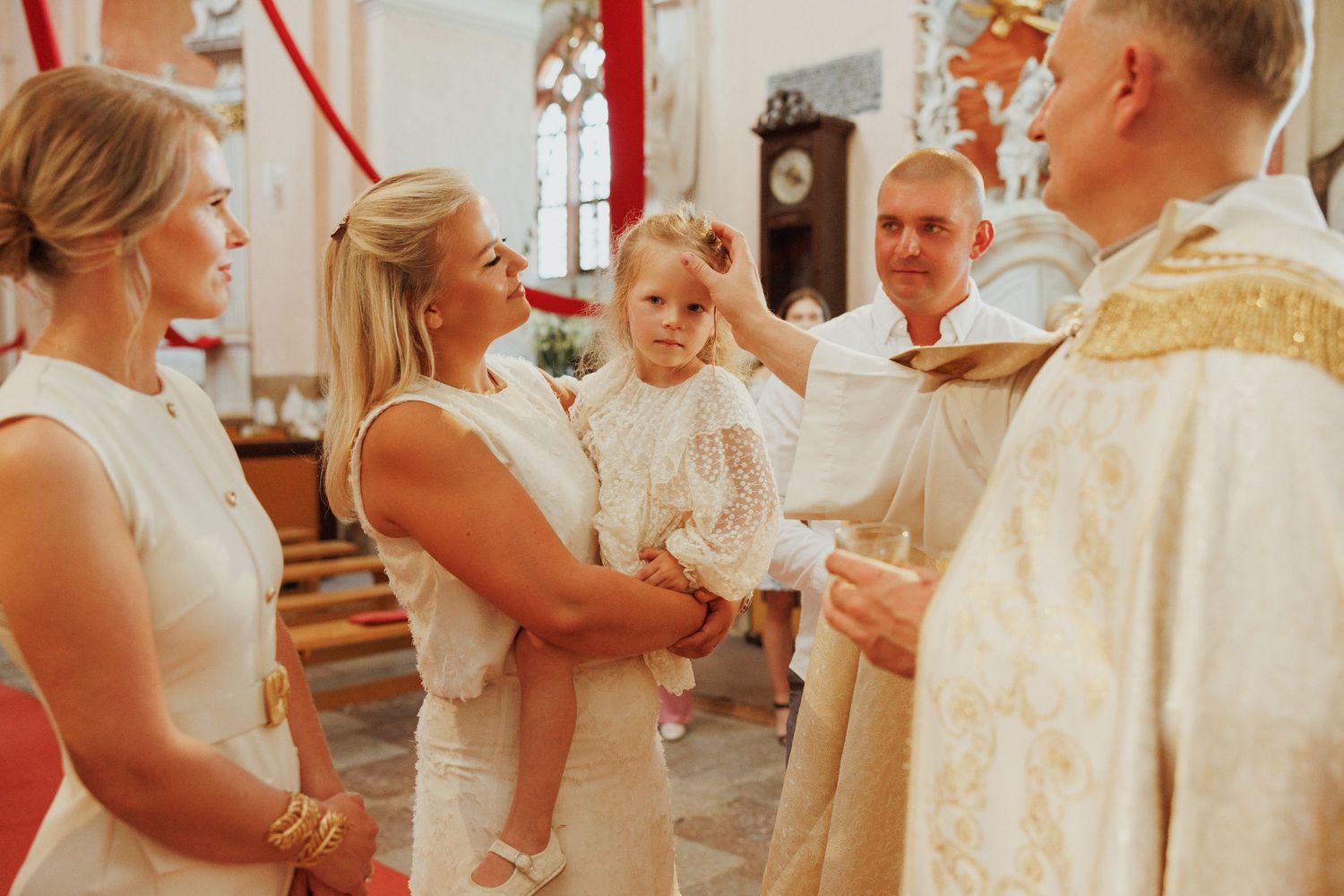 A collage of candid moments at a wedding celebration with guests in white and cream colored attire.