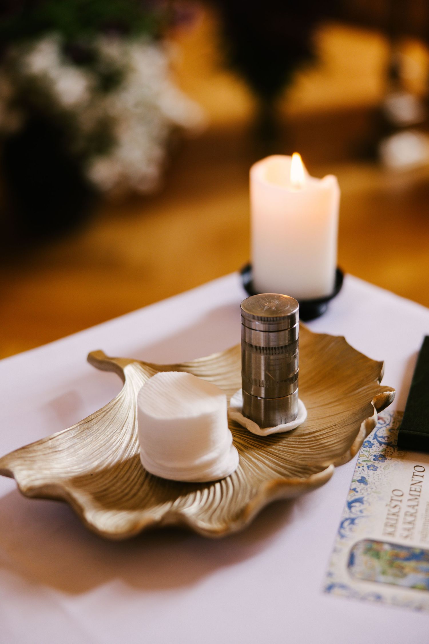 A series of decorative leaf-shaped candle holders with lit candles creating a warm ambiance.