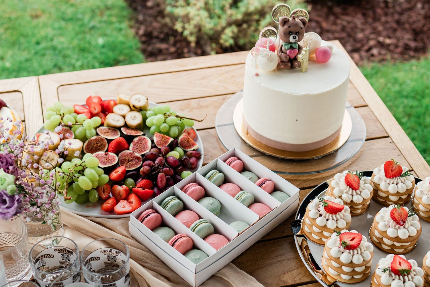 Beautifully arranged dessert table with fresh berries and sweet treats.