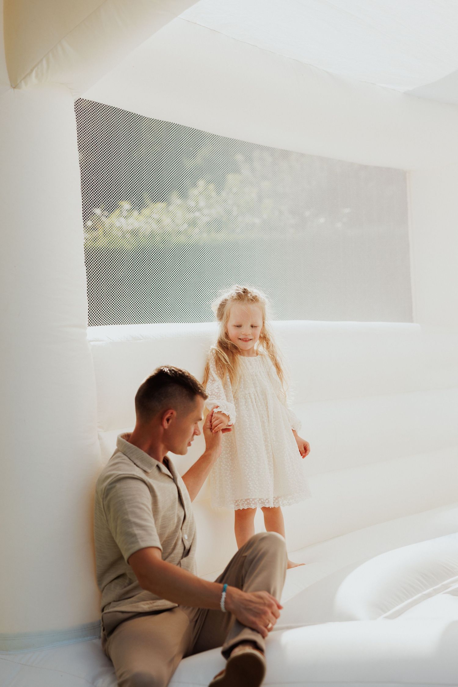 Light-filled indoor scene with people in casual attire.