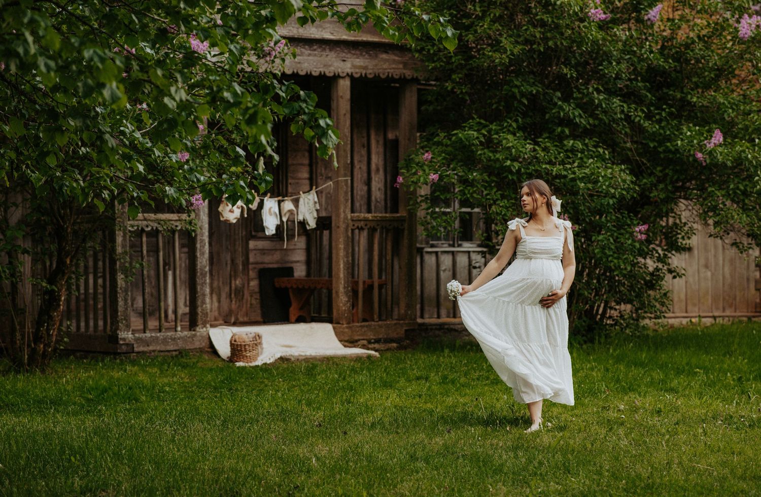 A peaceful garden scene with white dresses against a natural backdrop.