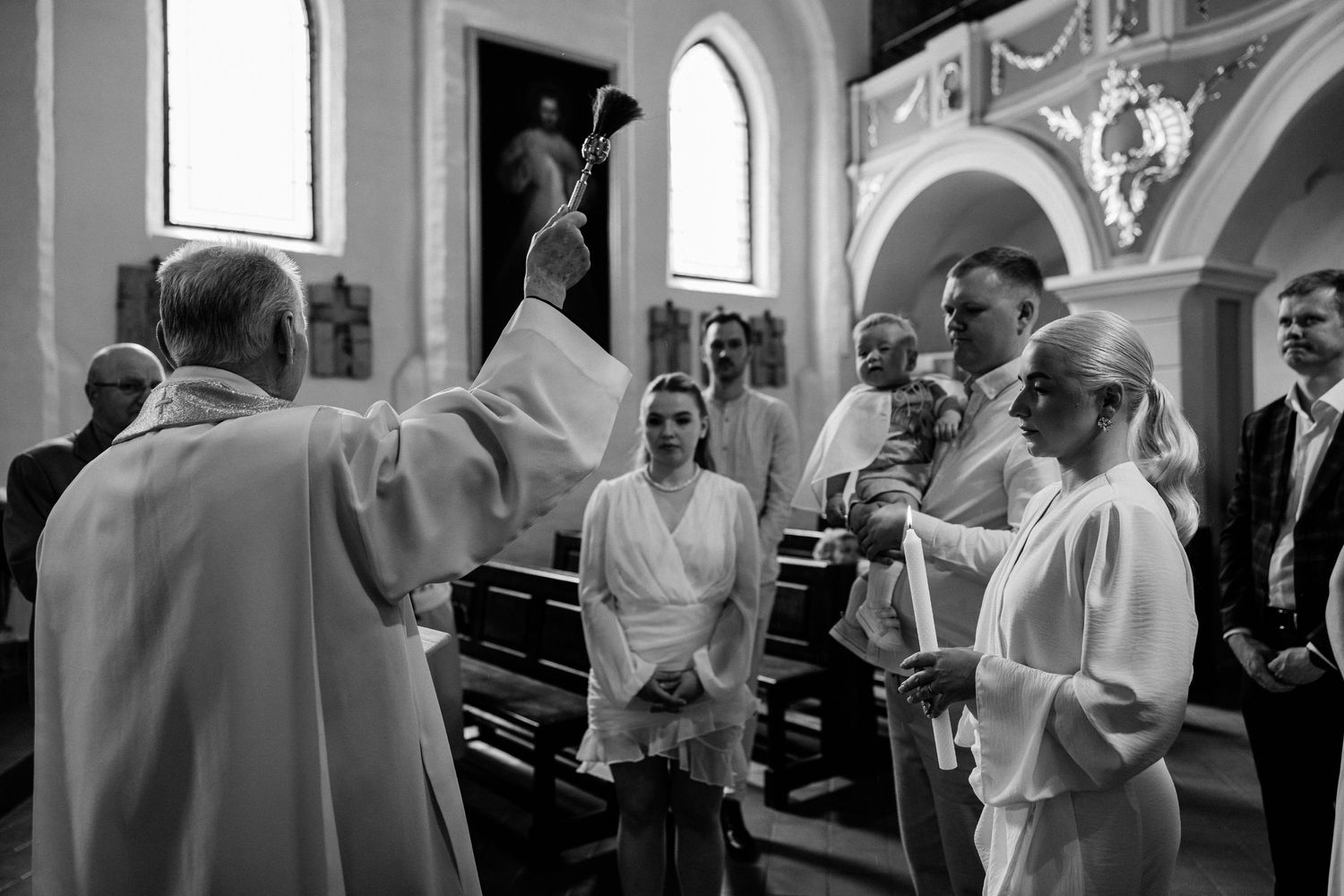 Black and white photos showing people gathered for a formal indoor ceremony.
