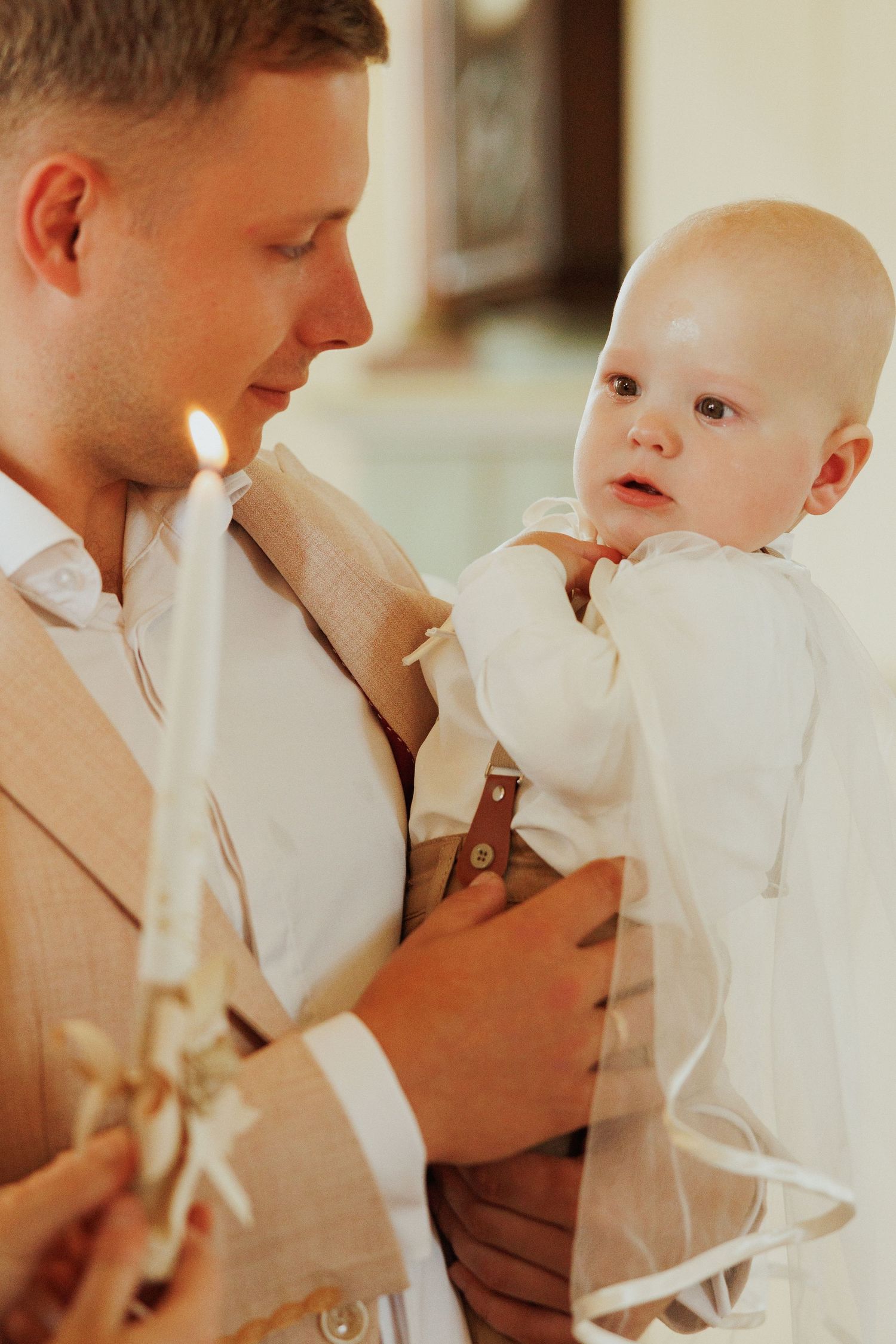 Intimate candid shots show a parent and young child sharing a close embrace while wearing formal attire.