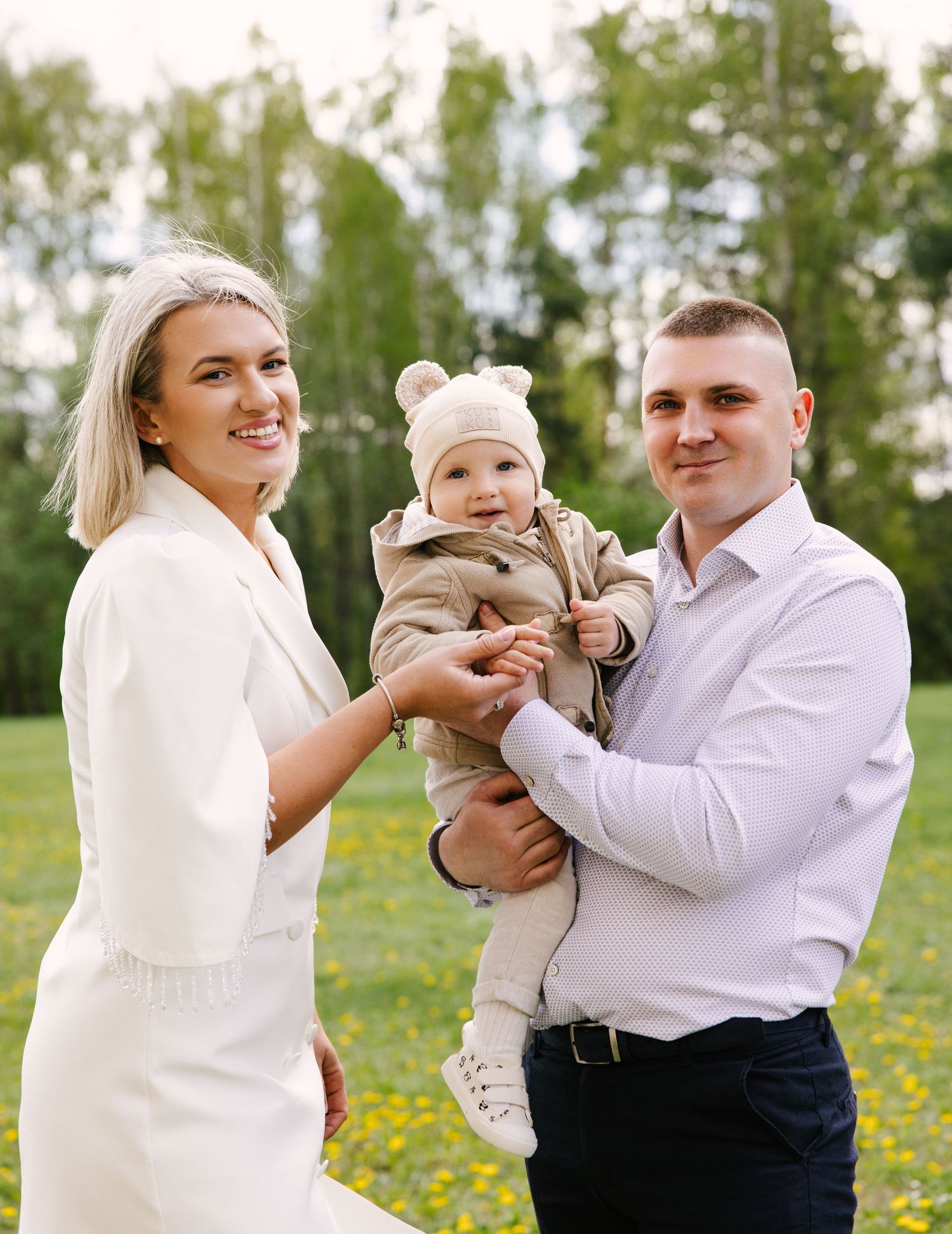 A playful sequence of photos showing a couple and child playing in a field of yellow wildflowers.