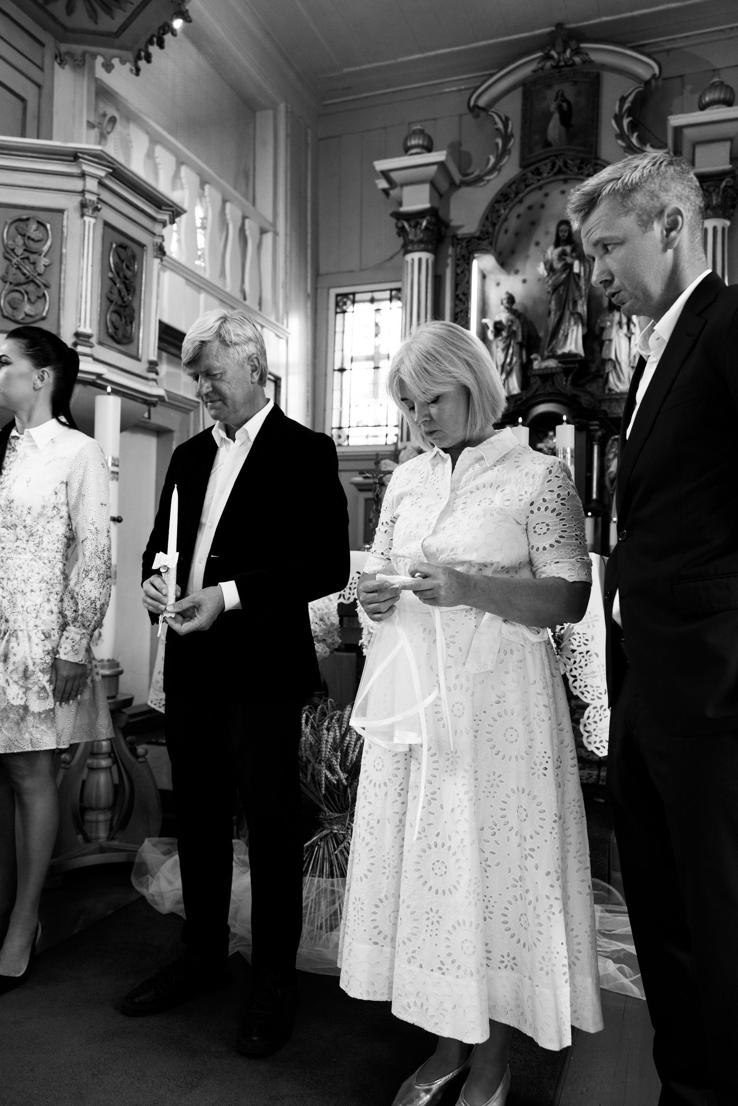 Black and white photo series showing guests mingling at an elegant indoor reception with formal attire.