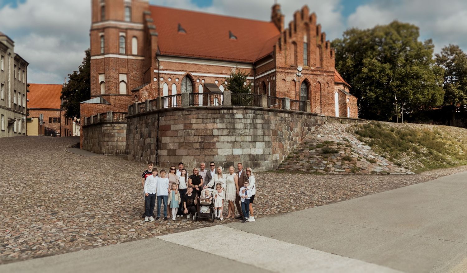 Historic red brick church with Gothic architecture and stone steps photographed from multiple angles in bright daylight.