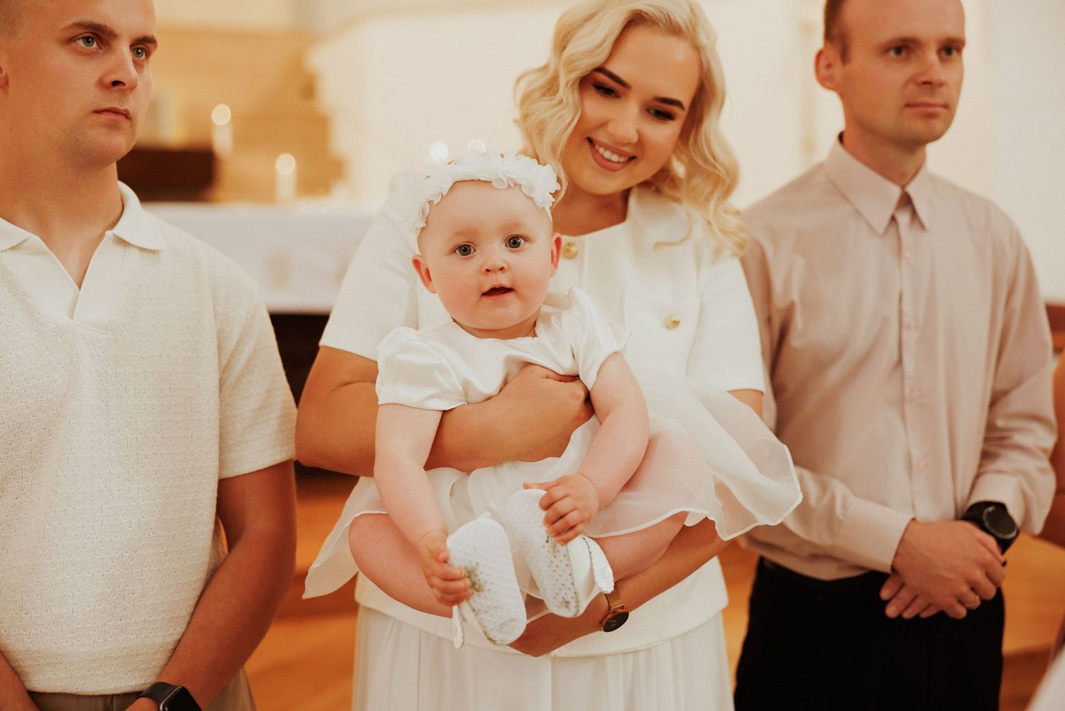 A series of formal wedding photos showing people in white and light colored attire celebrating at a wedding ceremony.