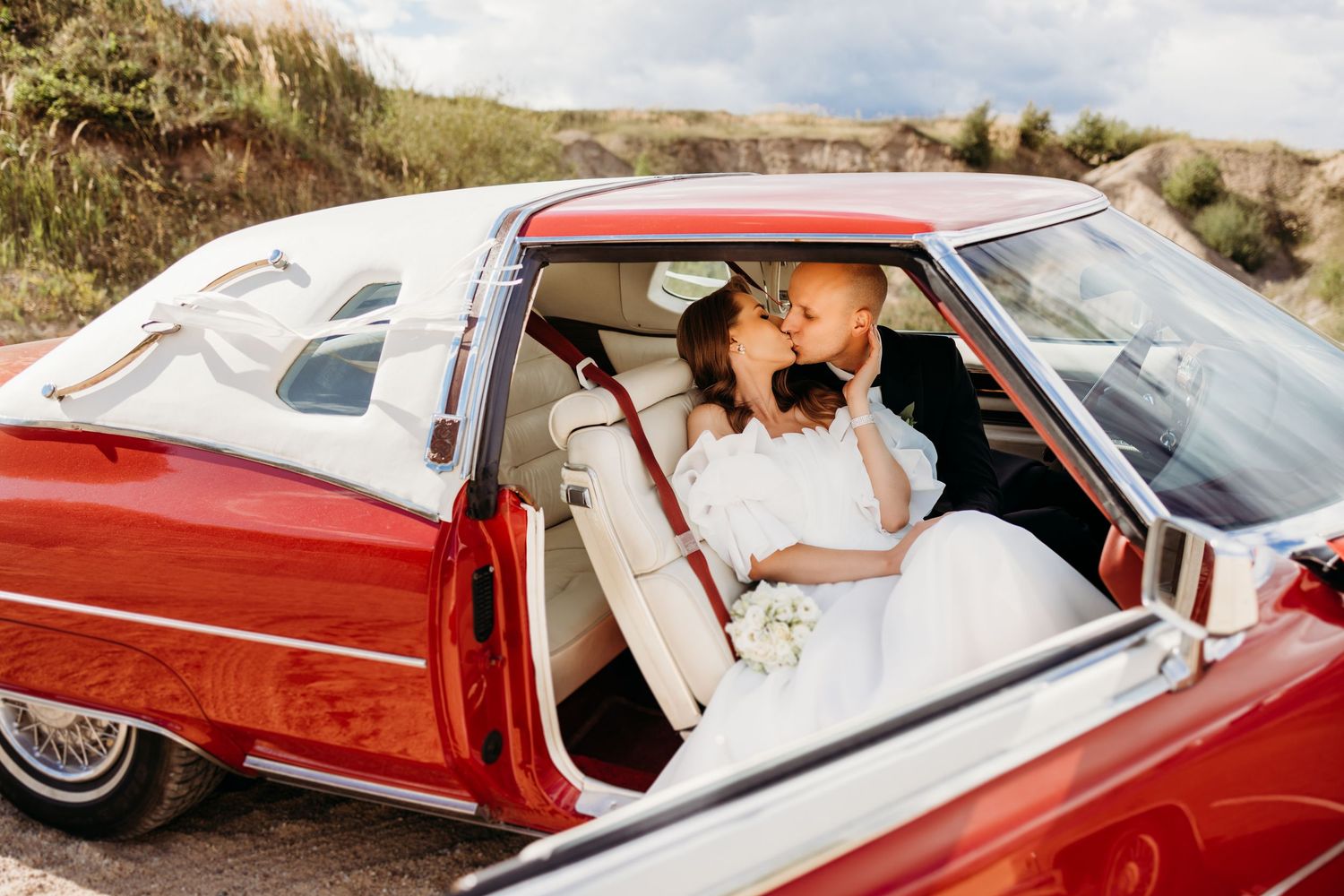 Series of photos showing a red classic Cadillac convertible in a desert landscape setting.