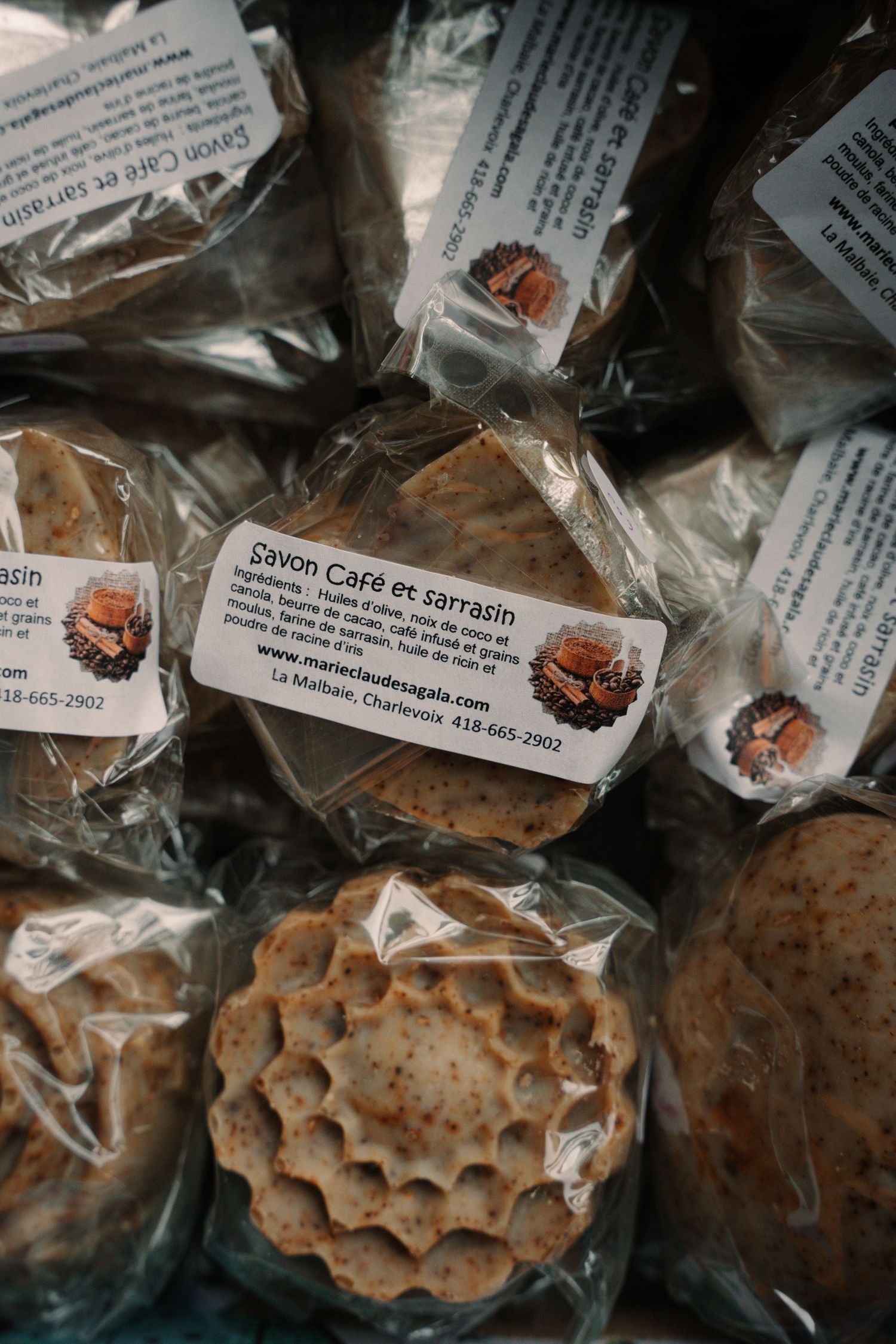 Packaged Savon Cafe et sarrasin coffee and buckwheat soaps stacked together with ingredient labels visible.