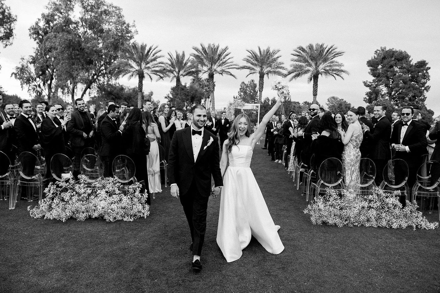 Wedding ceremony photography of couple walking down the aisle at Indian well Golf Resort.