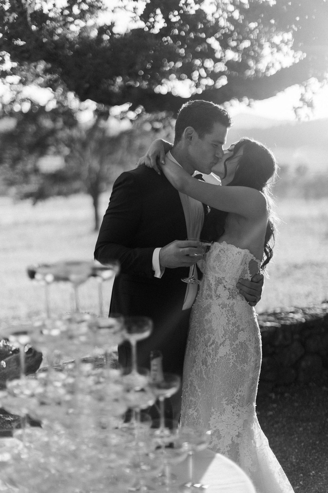 Black and white romantic wedding portrait captured in soft natural lighting.