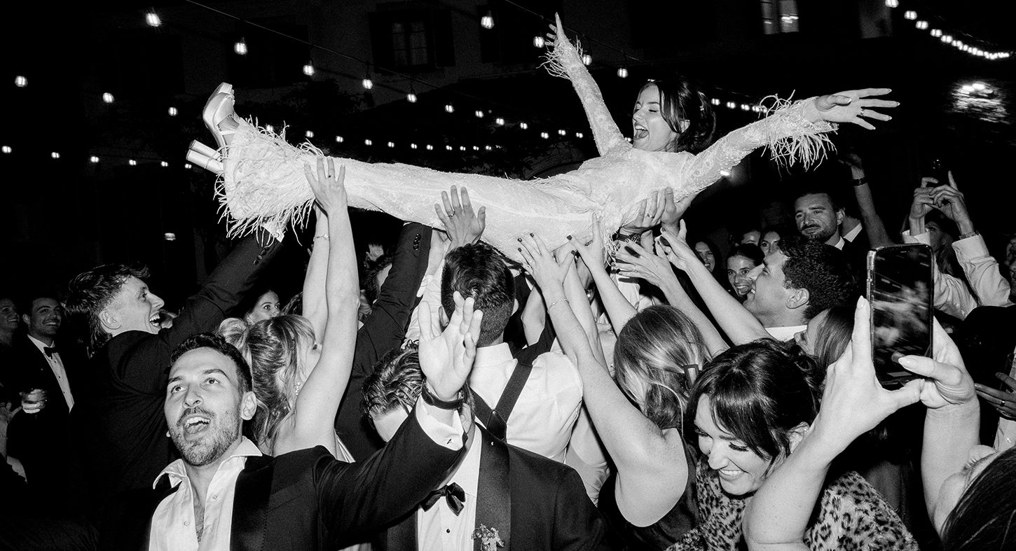 Black and white photos of wedding reception guests dancing and celebrating on the dance floor.