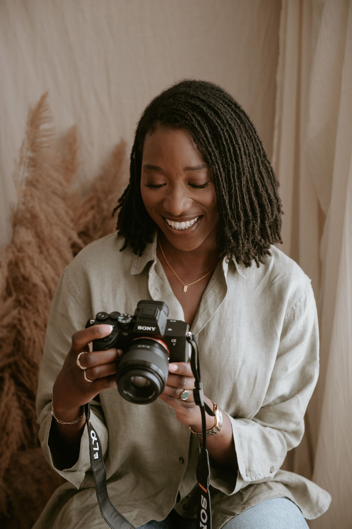 Black female photographer specialising in maternity, newborn and family photography