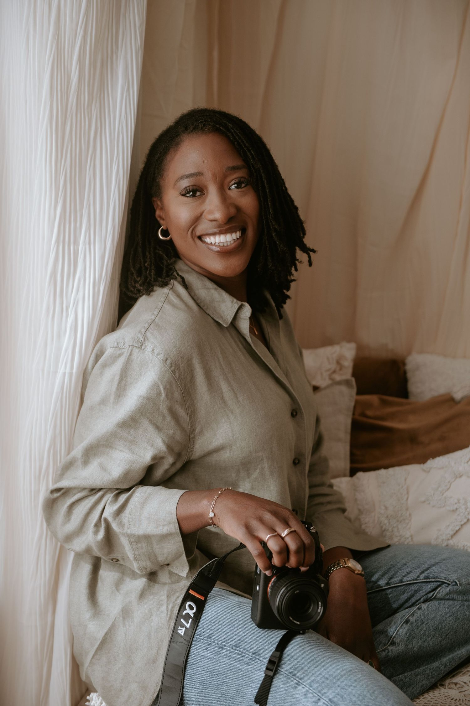 Black female photographer specialising in maternity, newborn and family photography