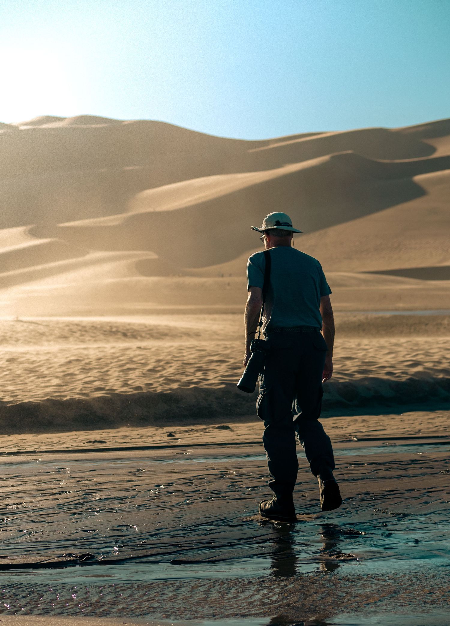 He trudges forth to the Dunes. Colorado Great Sand Dunes National Park during Summer 2024.   © Jack Curtis Photography.