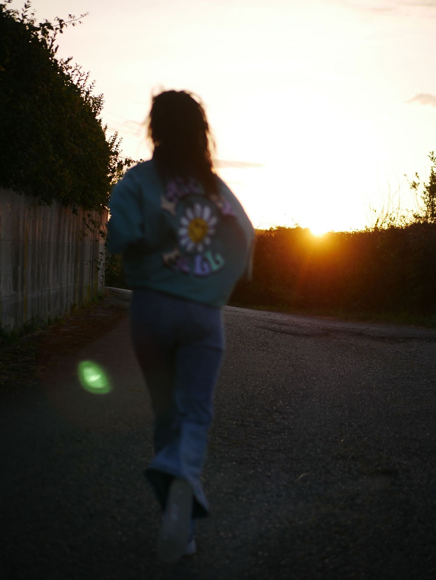 A girl runs for sunset. At Amigos Surf Camp in Comillas, Spain during Summer 2023.  © Jack Curtis Photography.