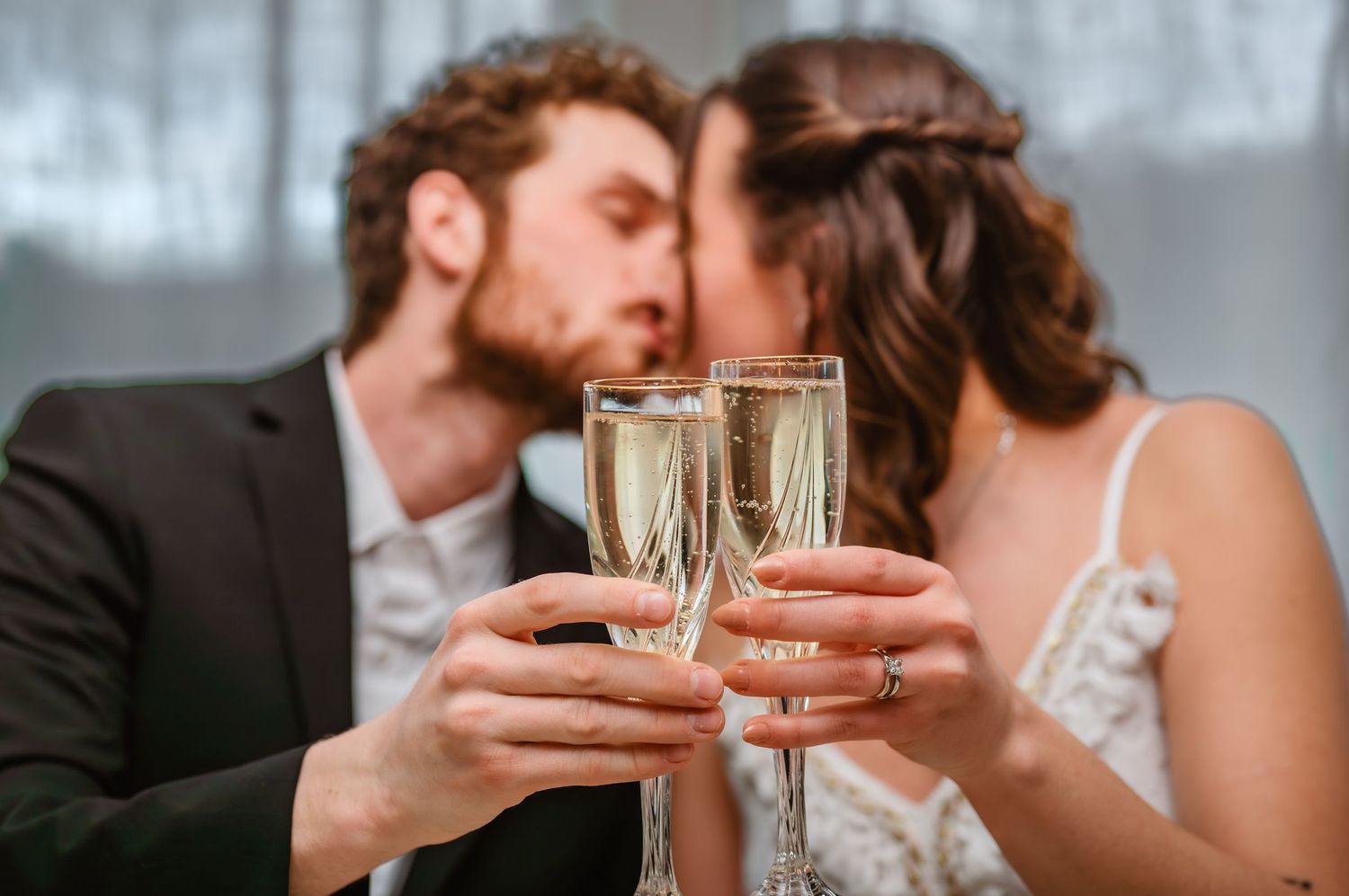 Wedding reception detail shots of champagne toasts and intimate moments.