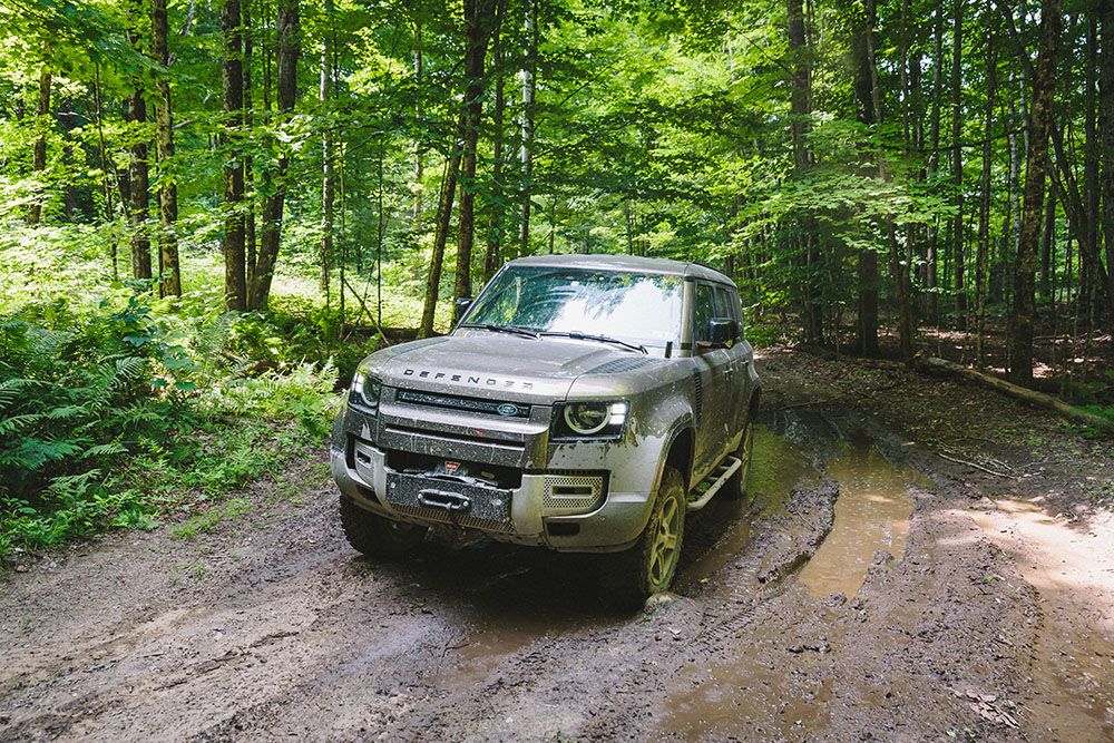 Land Rover Defender driving in off road setting in Boston New England