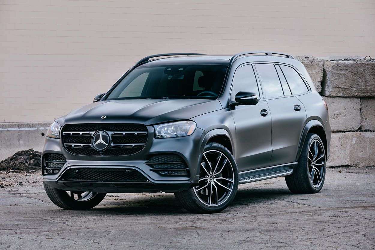 BLACK MERCEDES SUV WRAPPED VEHICLE INDUTRIAL SETTING