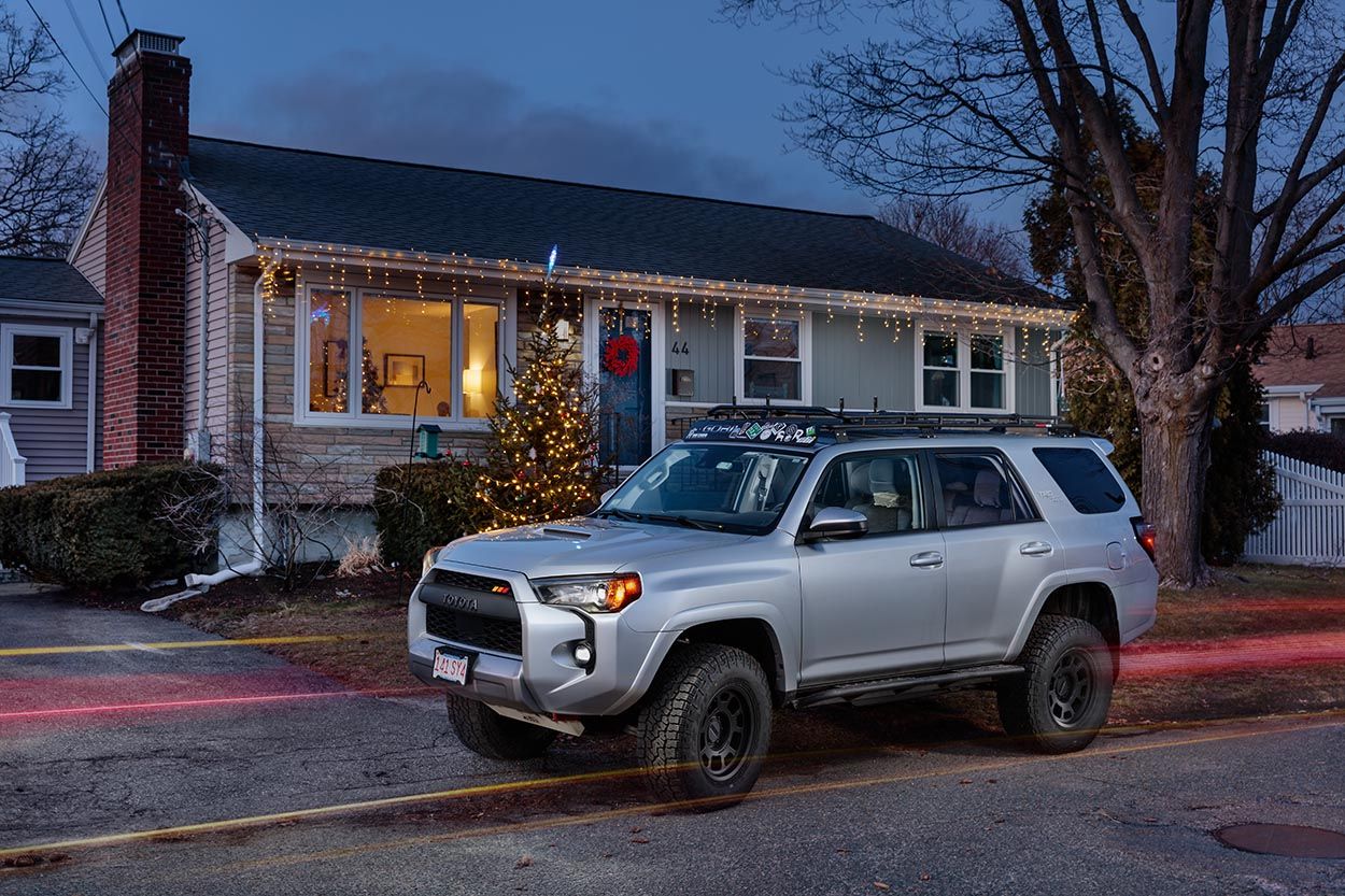 New England house with Toyota SUV parked outside