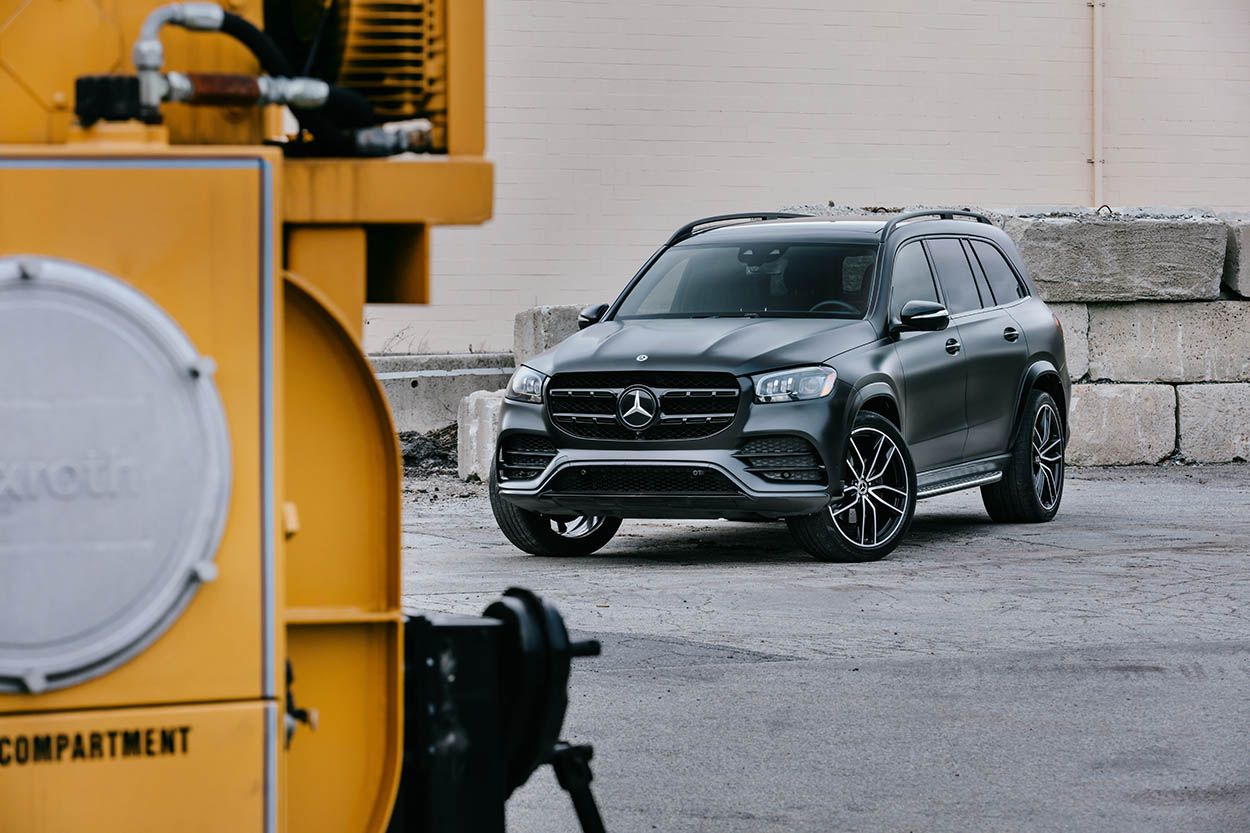 MERCEDES WRAPPED SUV PARKED IN INDUSTRIAL SETTING NEAR RAILWAY TRACKS FOR THIS BOSTON CAR PHOTOSHOOT