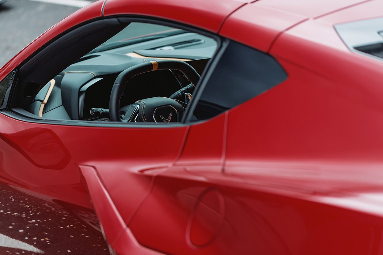 SIDE VIEW OF RED CORVETTE AT BOSTON CAR MEET UP