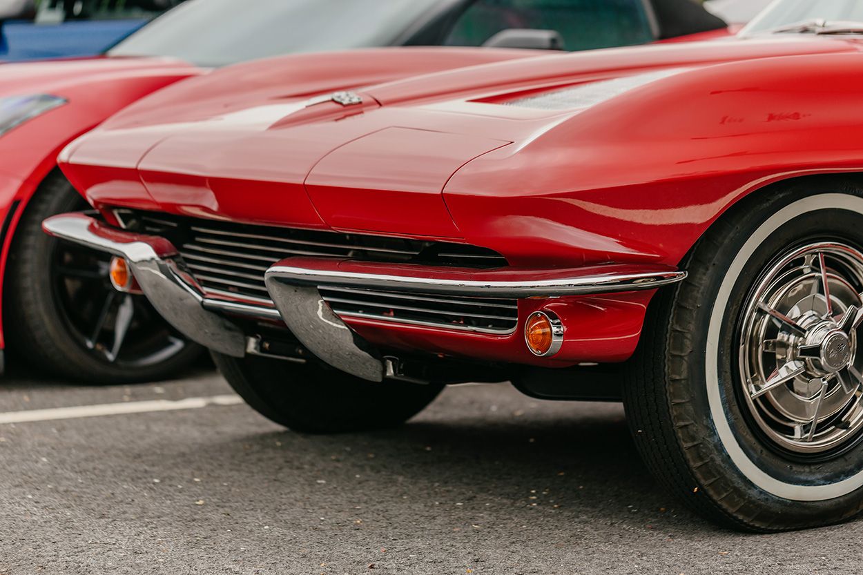 FRONT END OF RED CORVETTE CLASSIC AT NEW ENGLAND CAR MEET UP AND PHOTOSHOOT