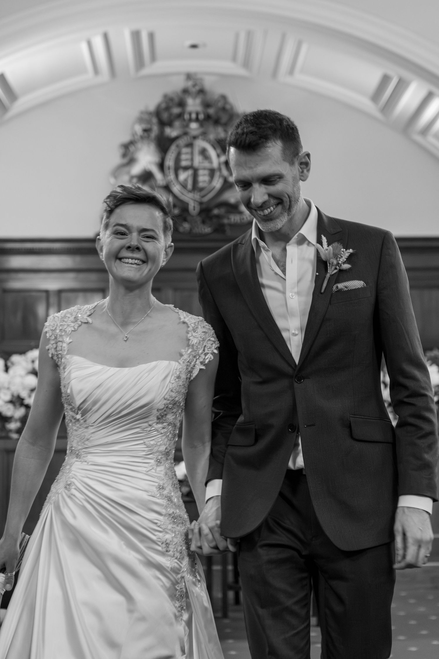Black and white wedding sequence showing joyful moments walking together.