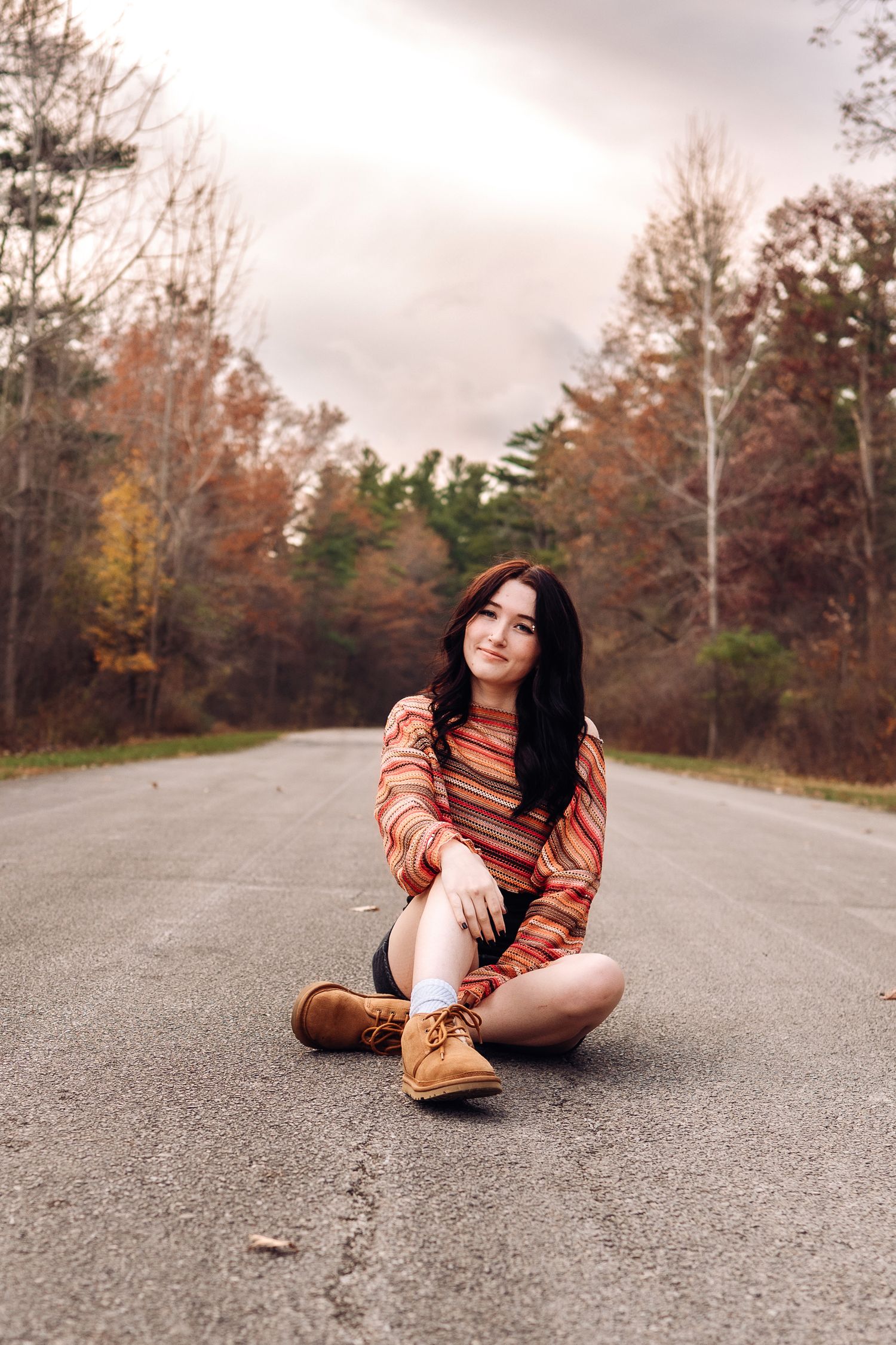 Senior photo session with a moody sky.