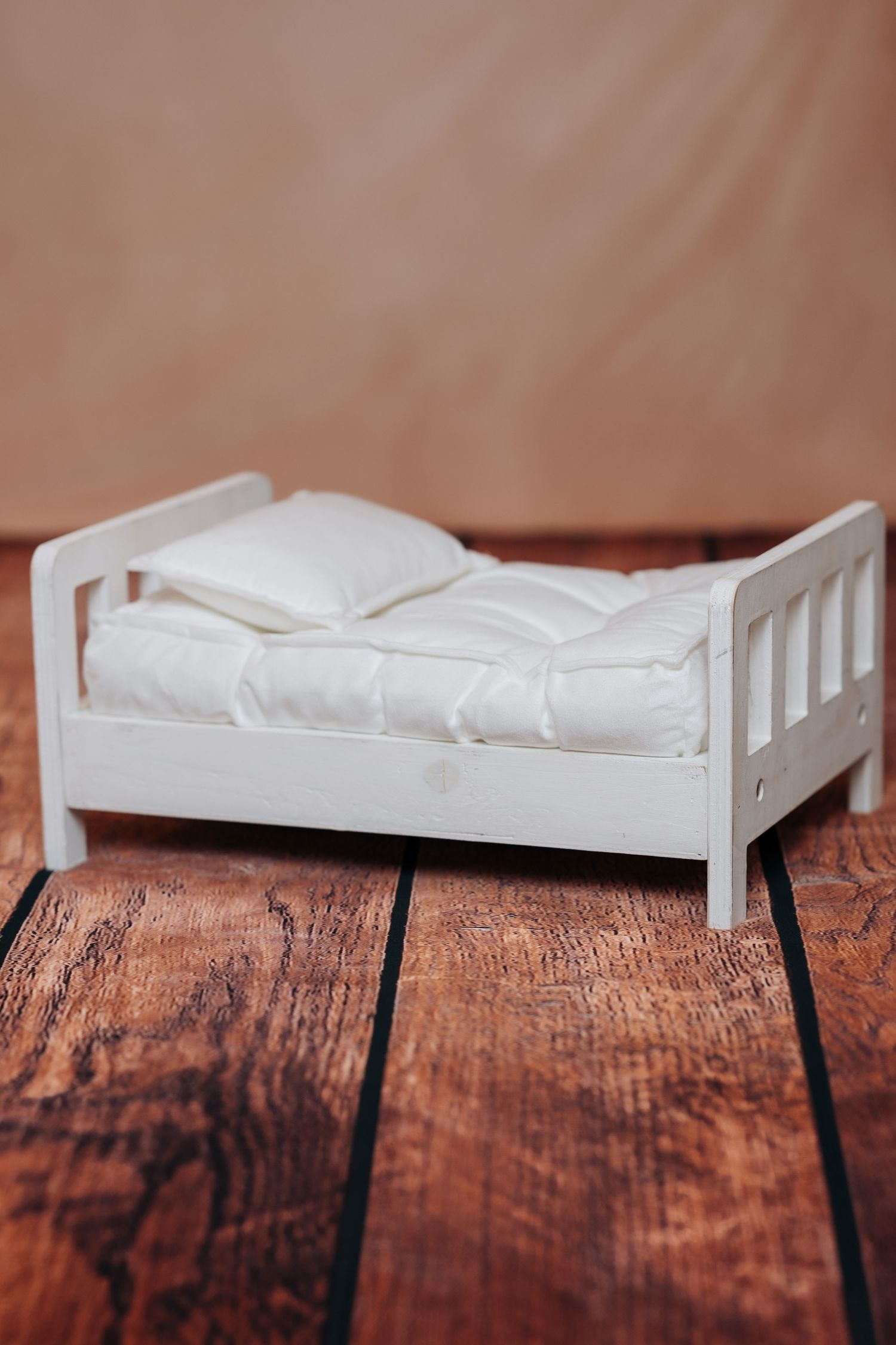 White wooden newborn bed prop.
