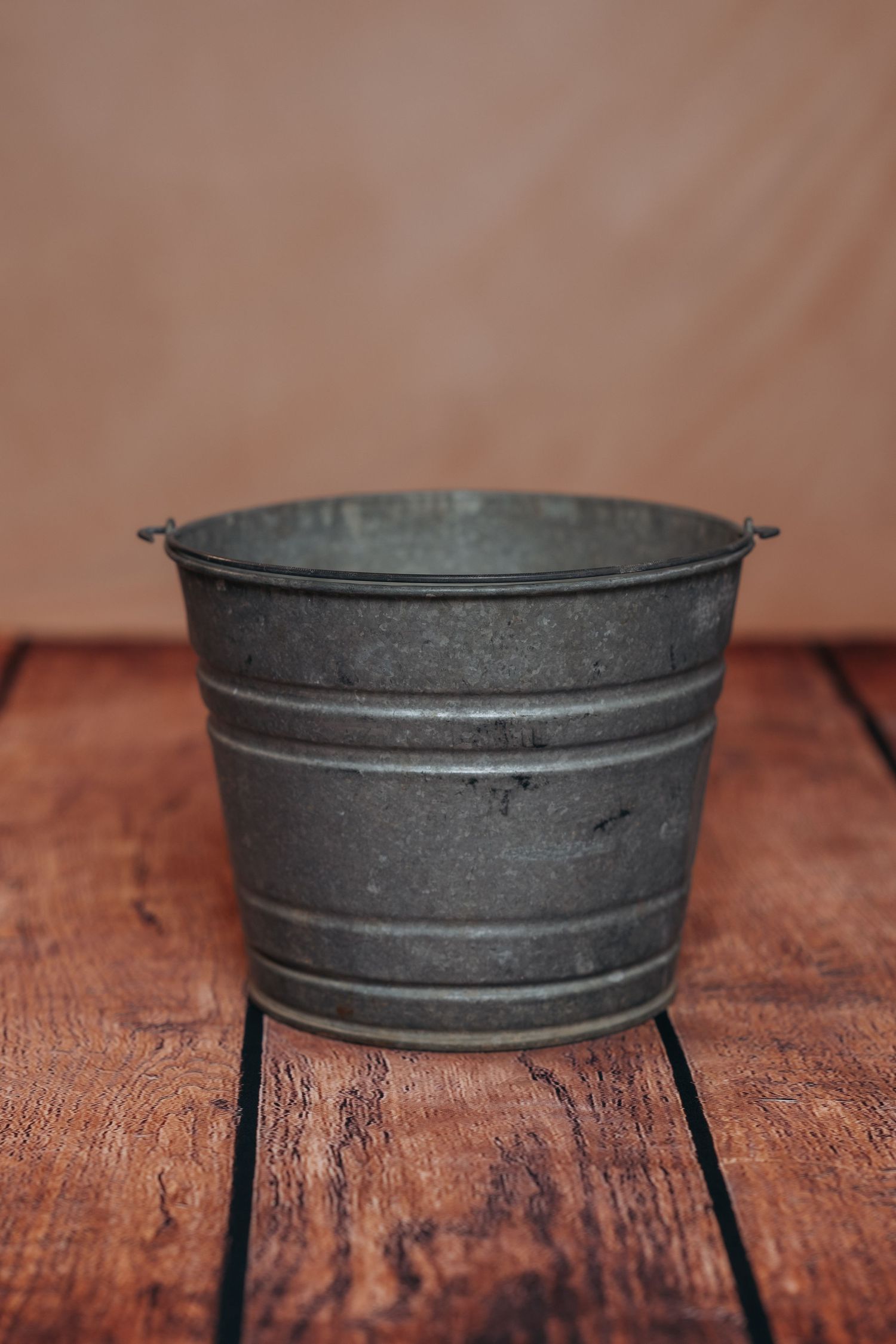 Metal bucket newborn prop.