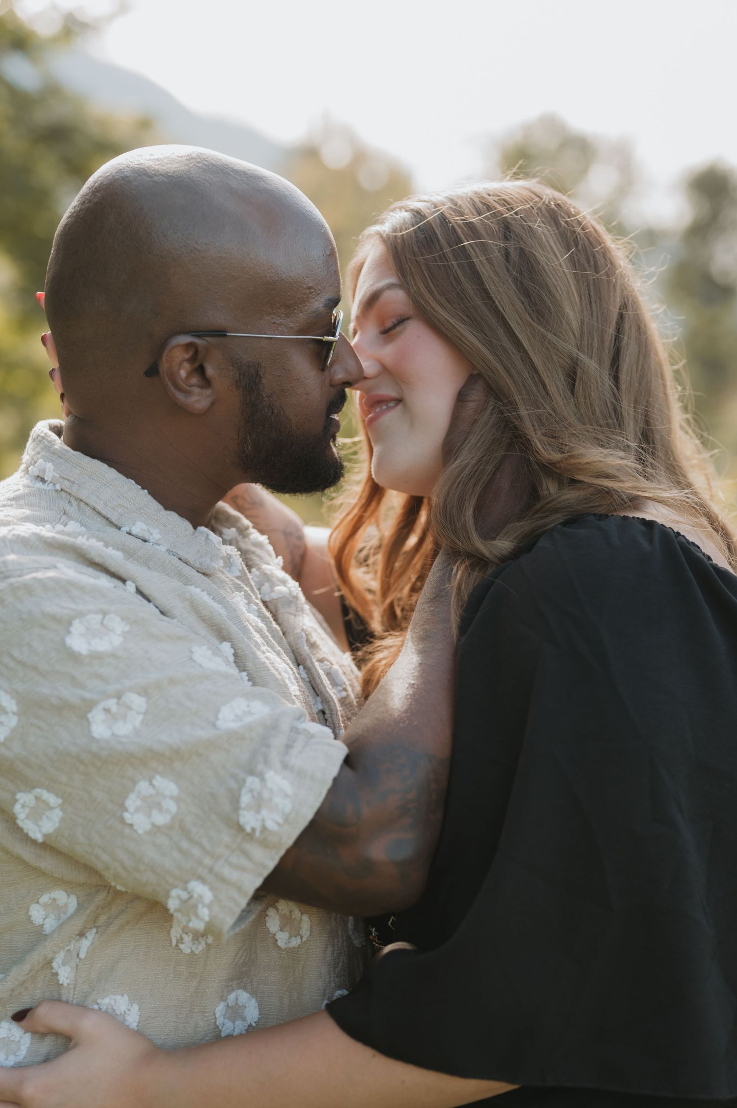 Couples outdoors session in a grassy field