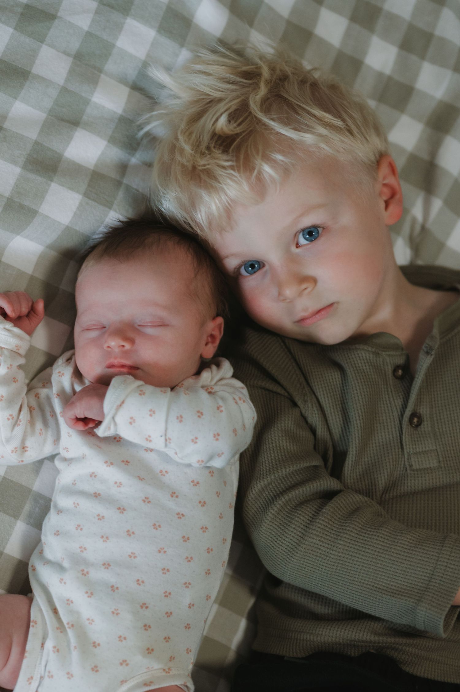 In-home lifestyle newborn family photography session, siblings photo