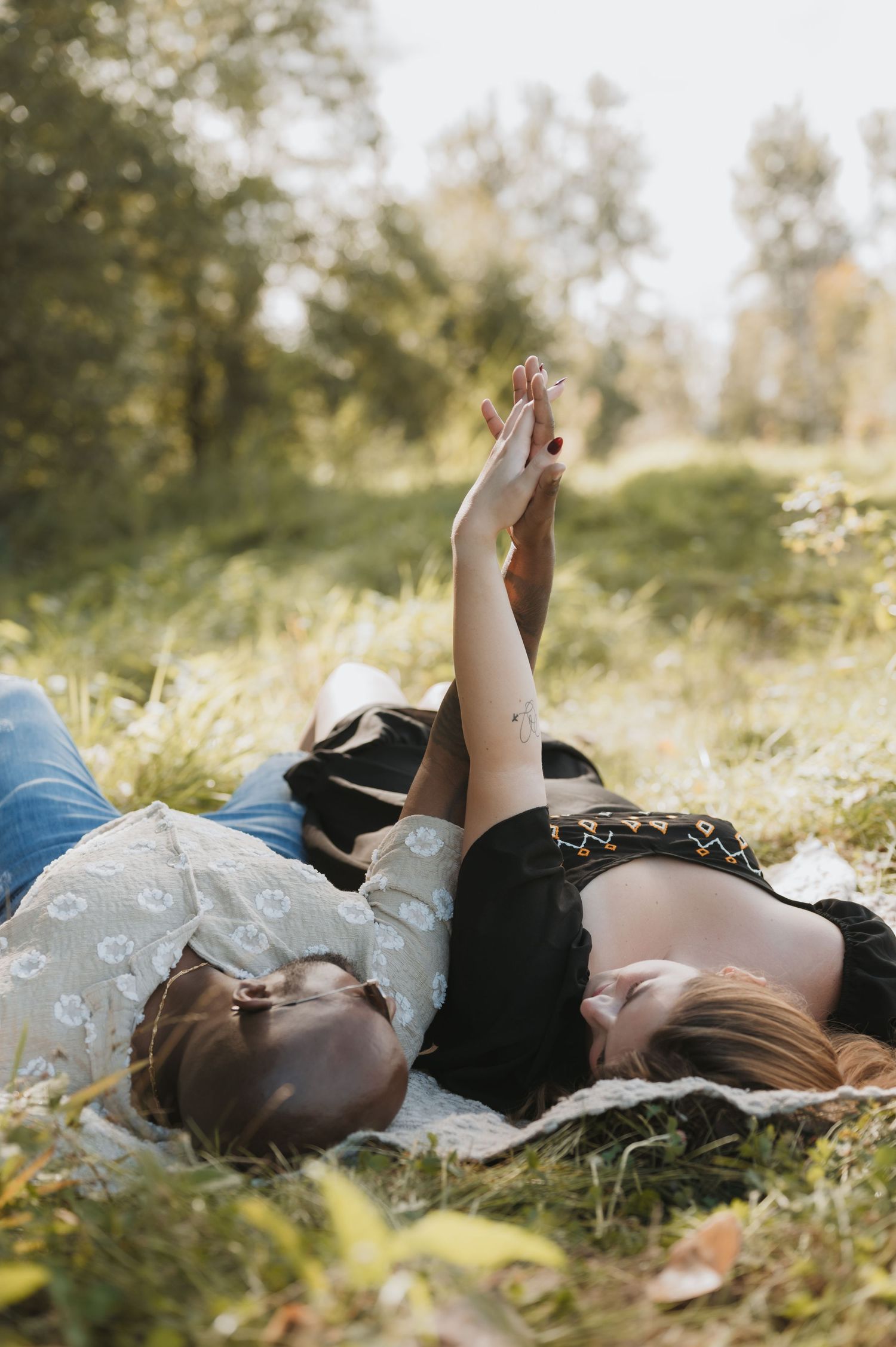 Couples outdoors session in a grassy field