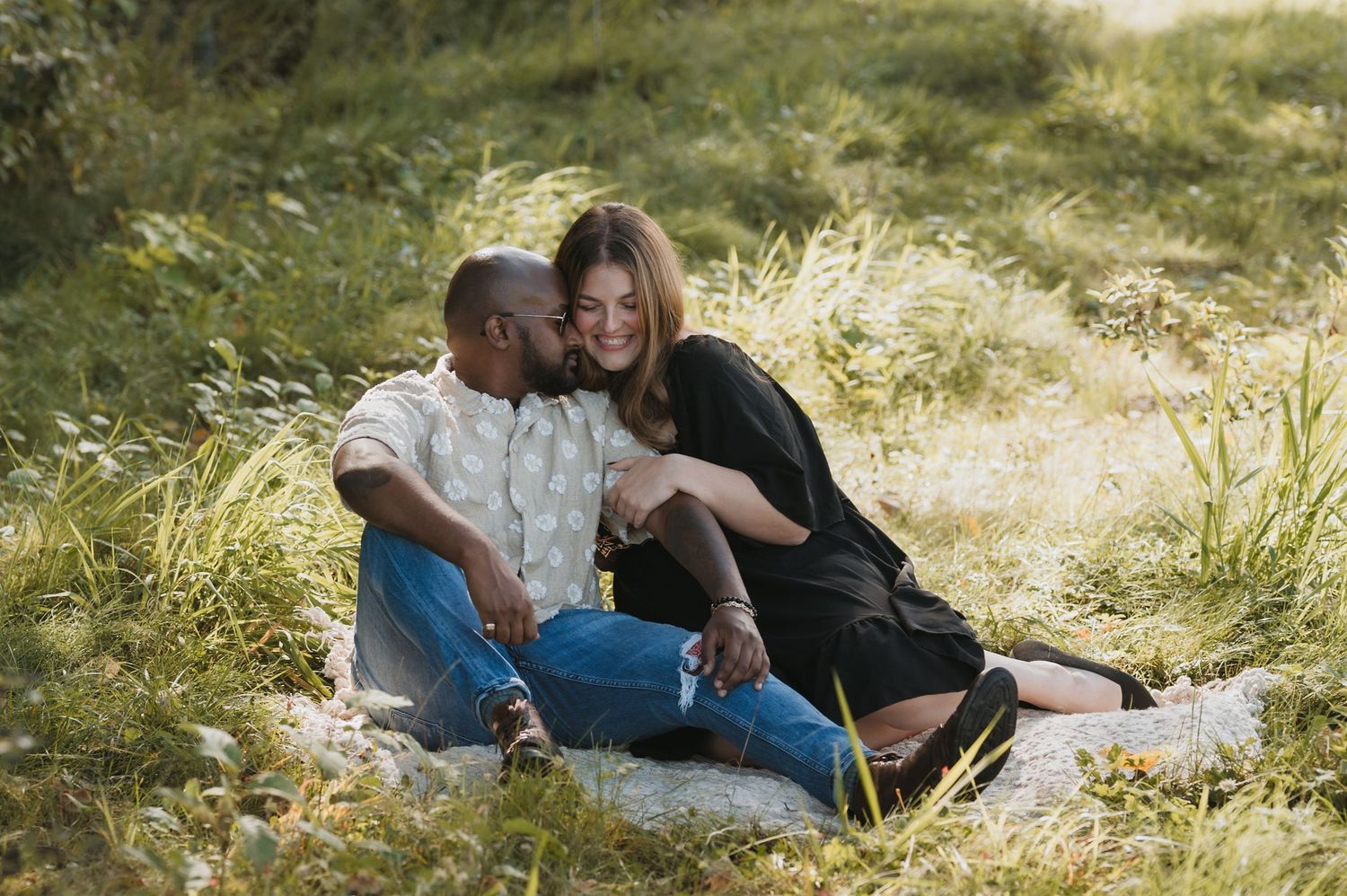 Couples outdoors session in a grassy field