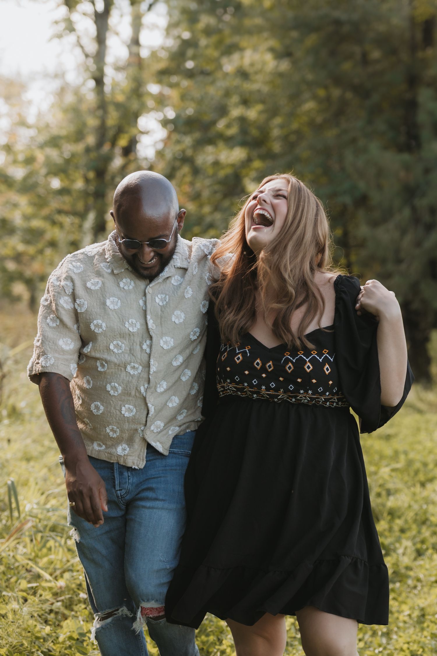 Couples outdoors session in a grassy field