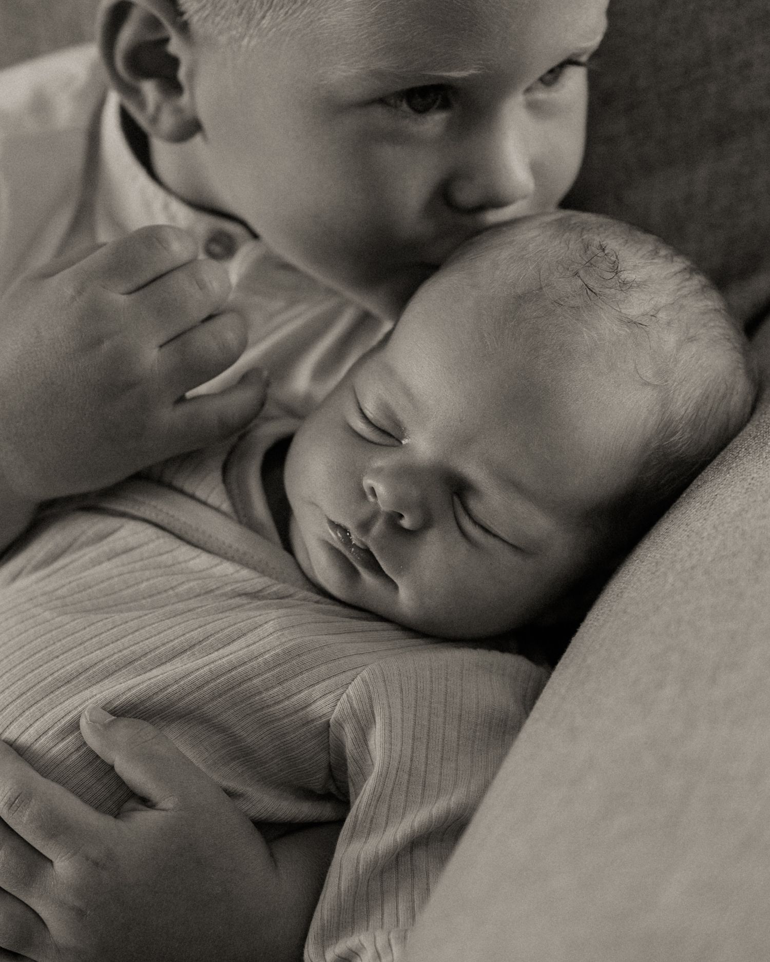 In-home lifestyle newborn family photography session. Newborn and sibling close-ups