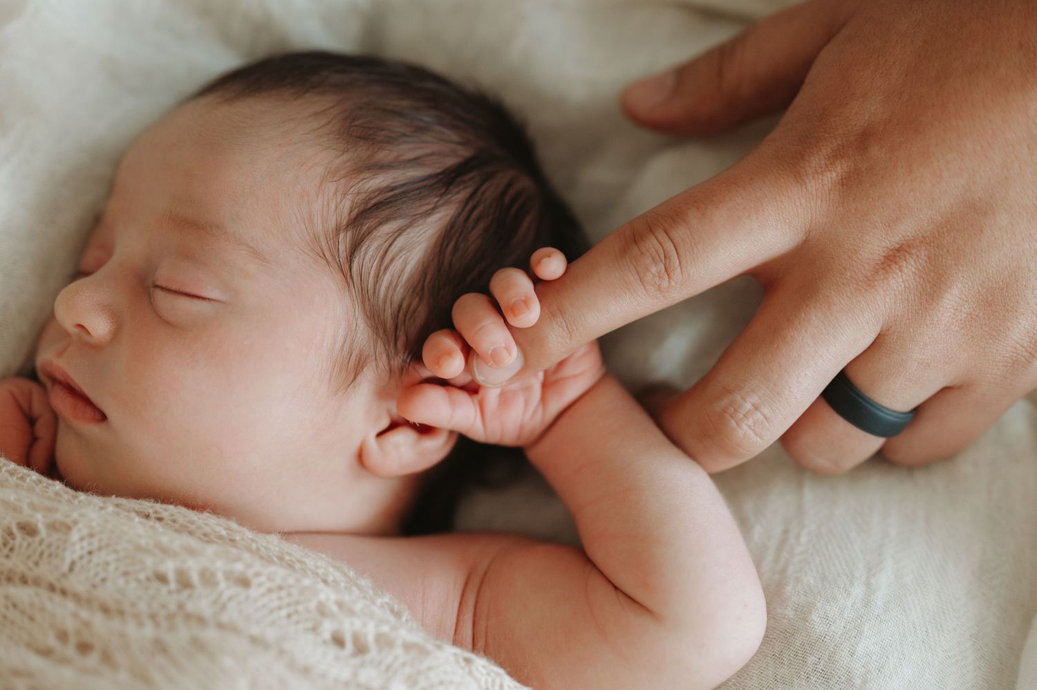 In-home lifestyle newborn family photography session, newborn close-up