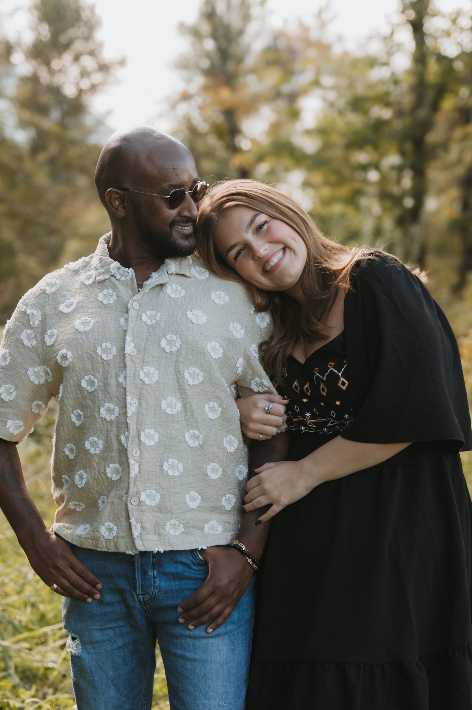 Couples outdoors session in a grassy field