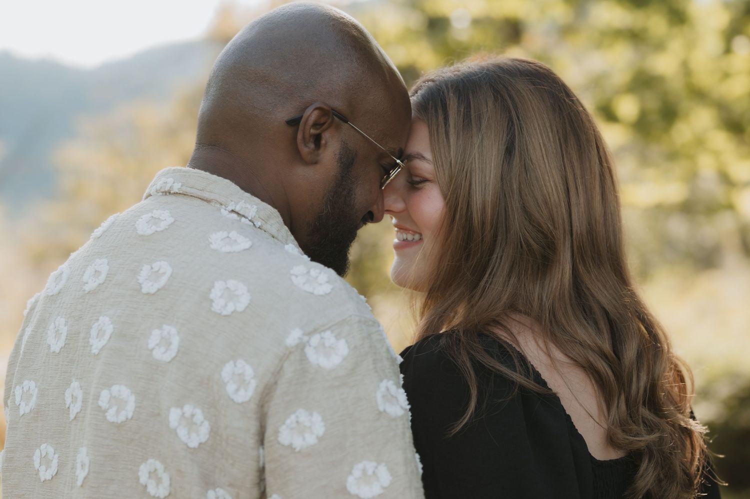 Couples outdoors session in a grassy field