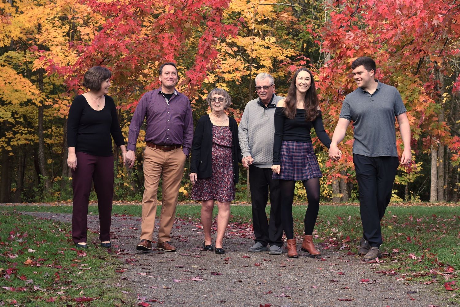 Three generations together for a lovely autumn family photo session to celebrate a 60th wedding anniversary. Jackson Park, Peterborough.