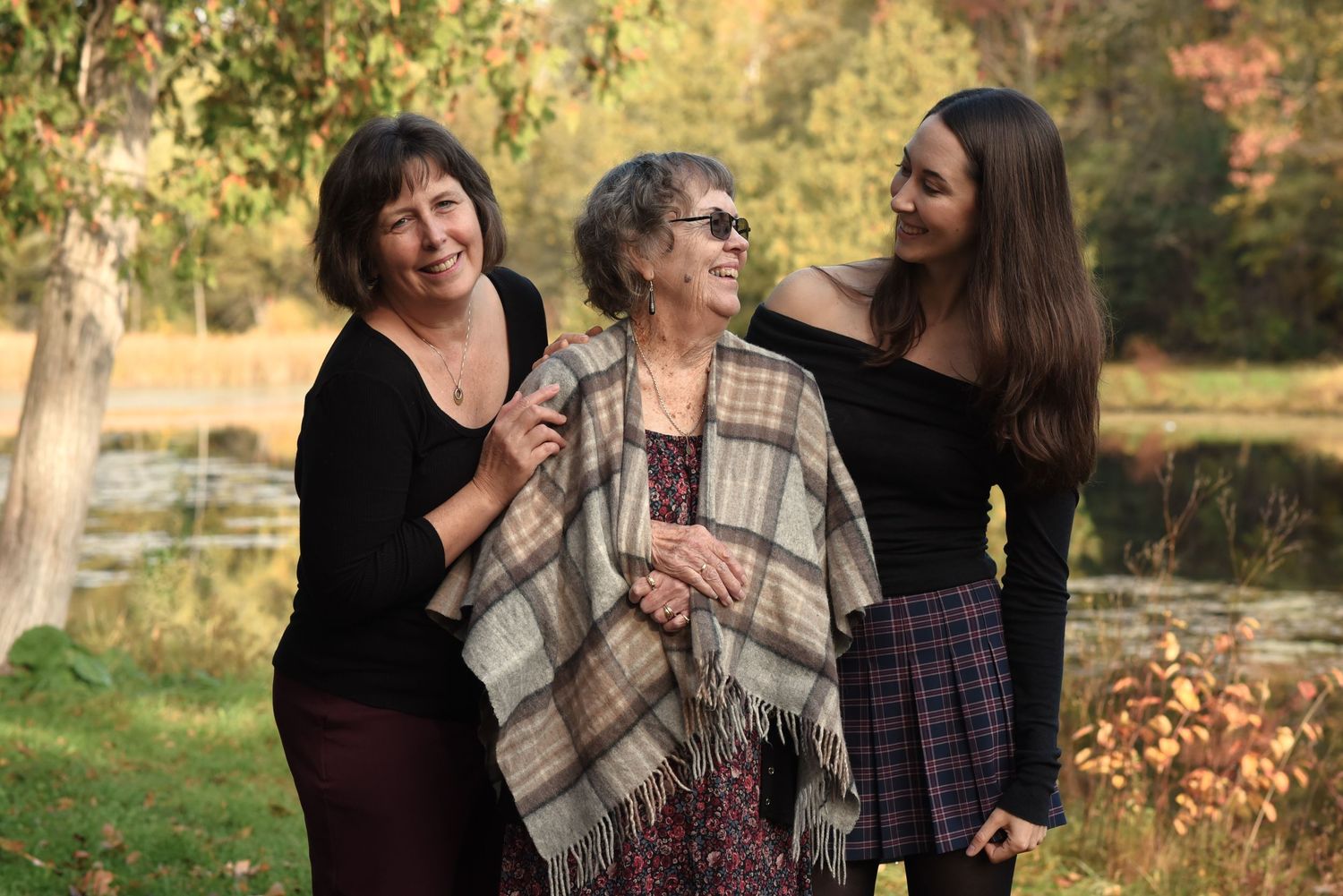 Three generations of women enjoying the colourful autumn weather at Jackson Park, Peterborough, Ontario. A lovely spot for family sessions.