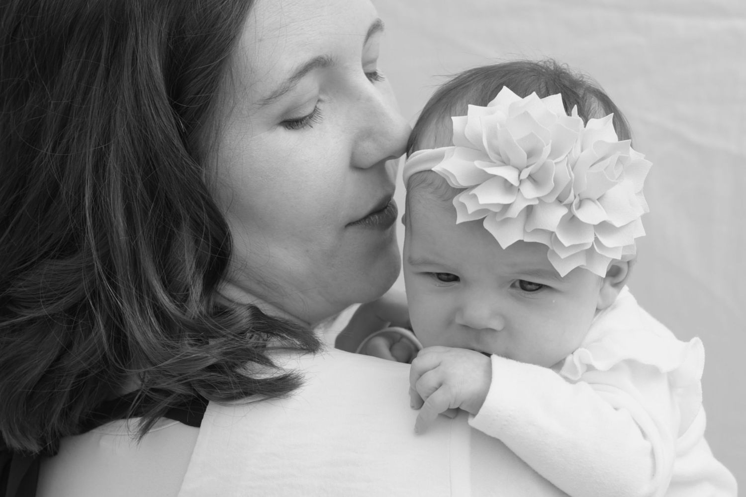 A mother's love, a sweet pose wtih baby. Outdoor spring family session.