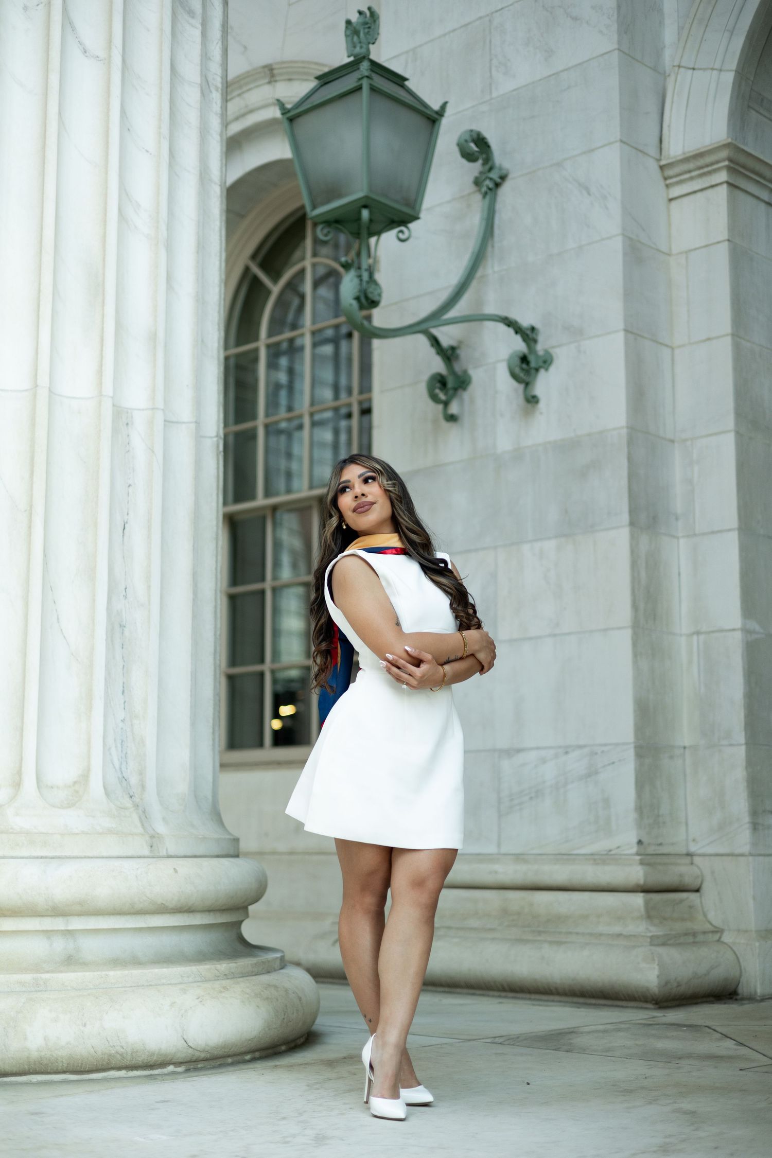 Artistic photo series showing a person in a white dress leaning against classical stone columns at different angles.