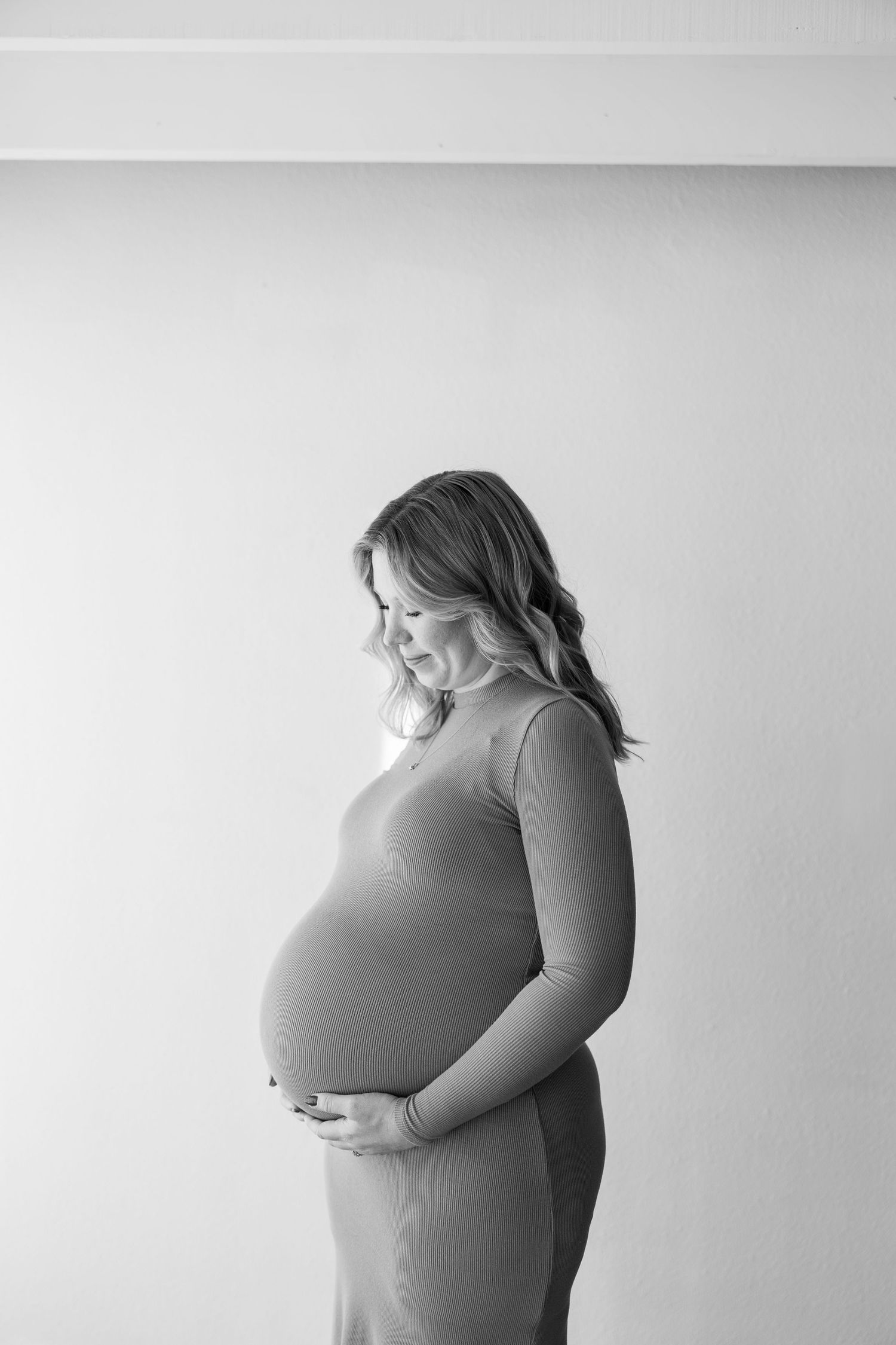 Artistic black and white photo series showing a person in profile against a plain light background.