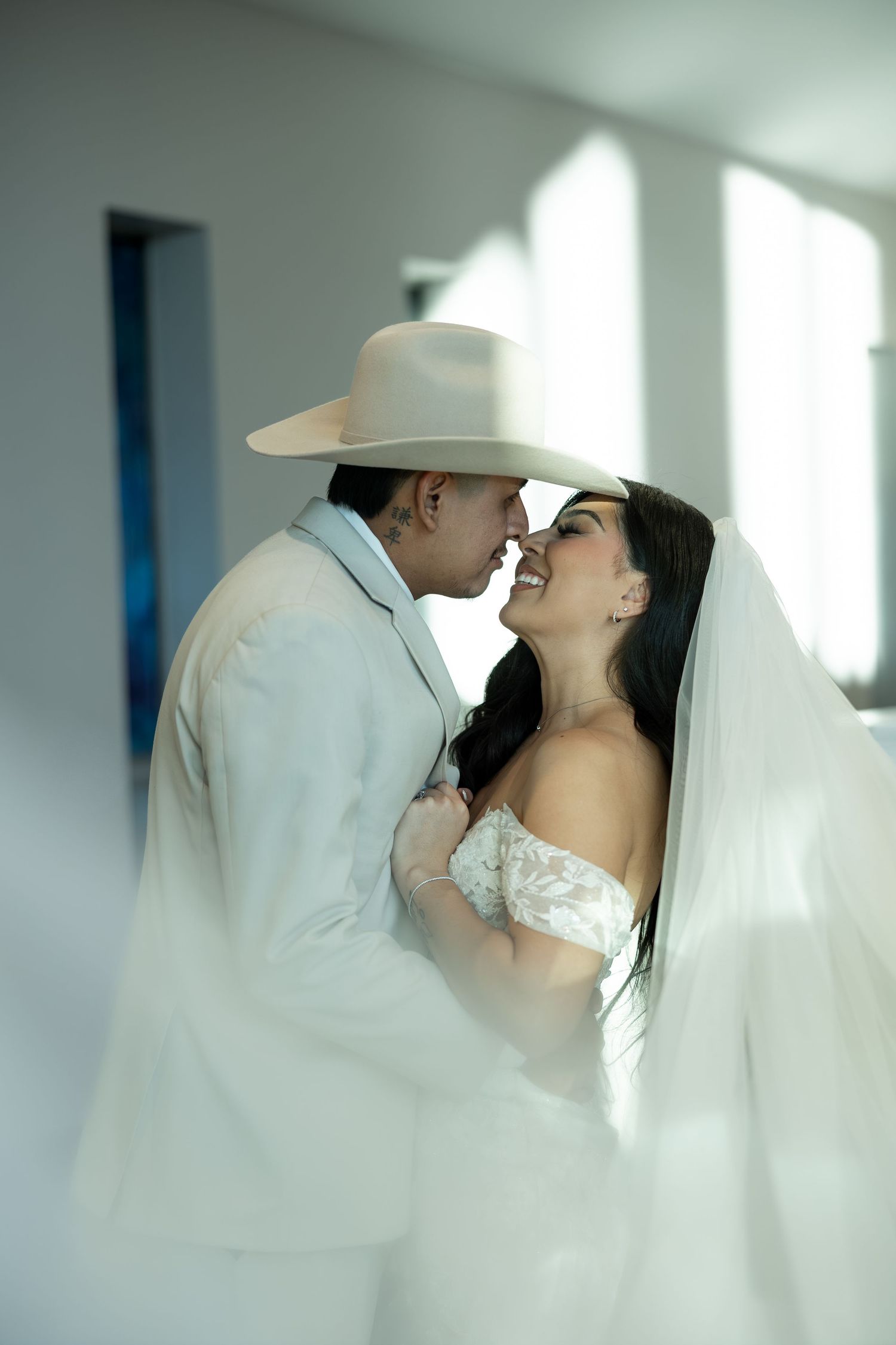A romantic wedding moment captured through soft, dreamy lighting.