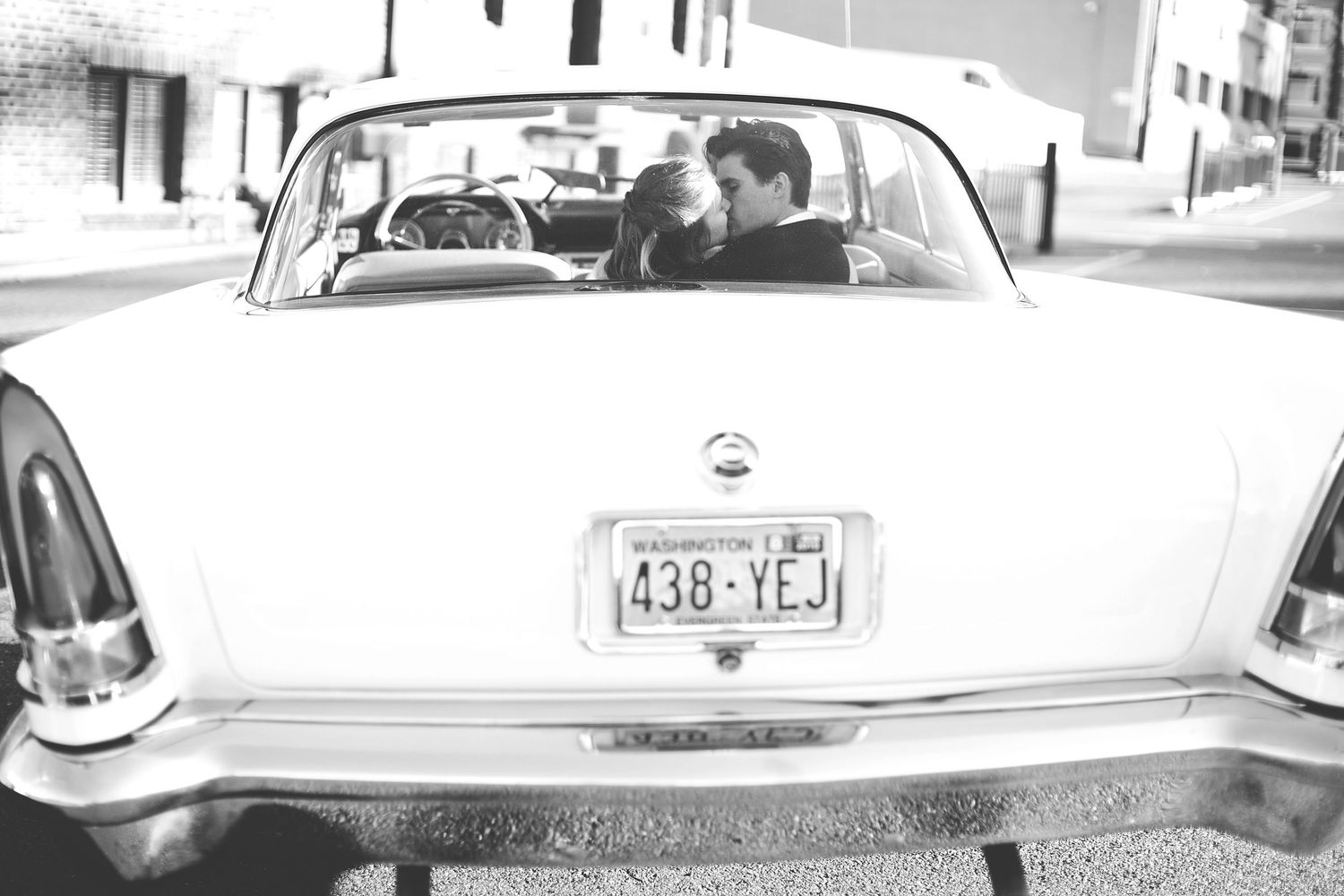Classic white vintage car decorated for a wedding celebration.