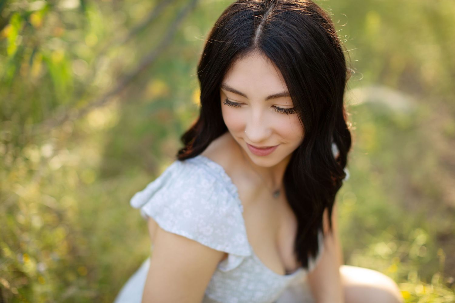 A series of natural light portraits showing joyful expressions and laughter in an outdoor setting.