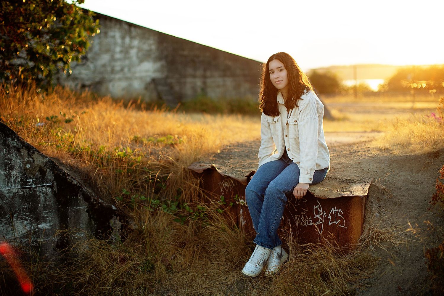 Outdoor portrait session at sunset with rustic backgrounds and natural poses.